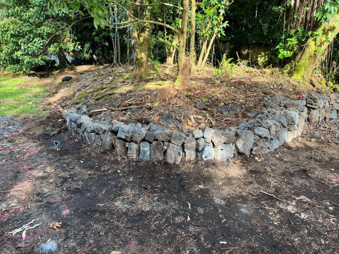 Curved lava-rock garden wall